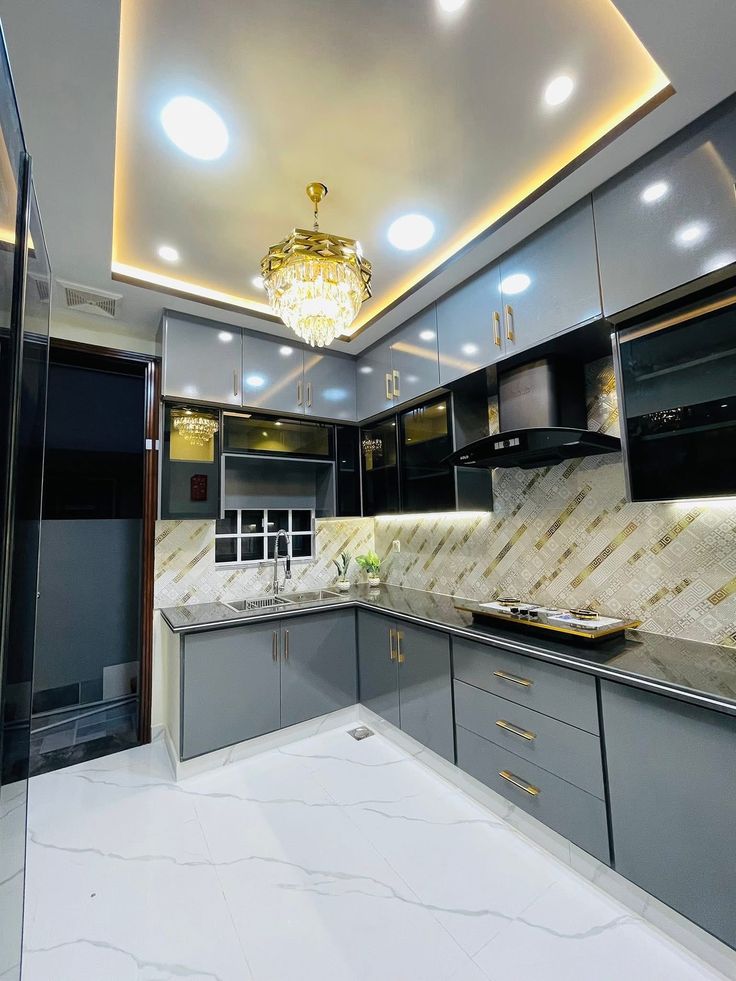 Contemporary designer kitchen with fluted gold accents and quartz worktops